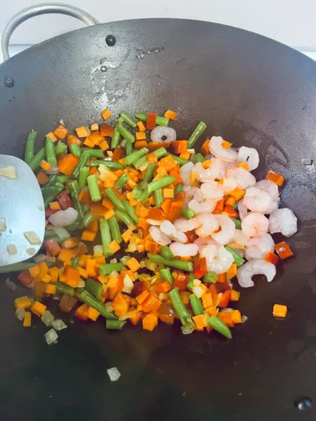 Add shrimp to nasi goreng